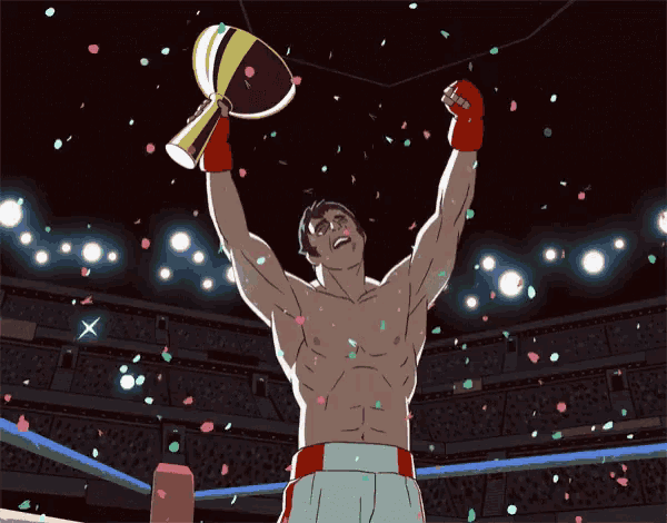 a man in a boxing ring is holding a trophy in his hand