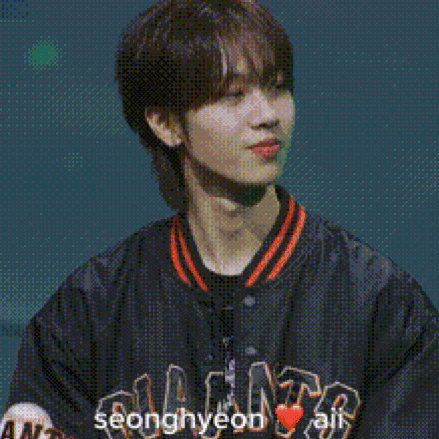 a man wearing a jacket that says ' seonghyun ali ' on it