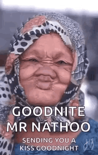 a woman wearing a scarf around her head is making a funny face .