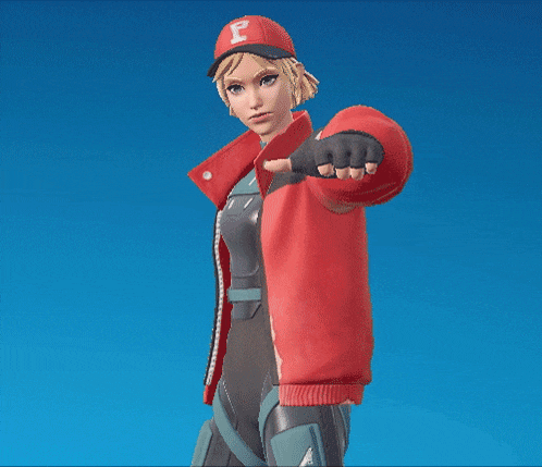 a woman wearing a red jacket and a hat is standing in front of a blue sky