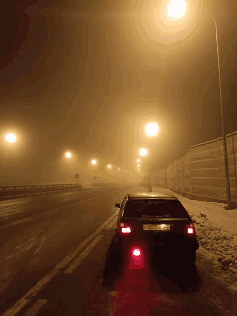 a car is parked on the side of a road with a license plate that says oy - yp - 334