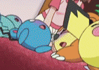 a group of cartoon characters are laying on top of each other .