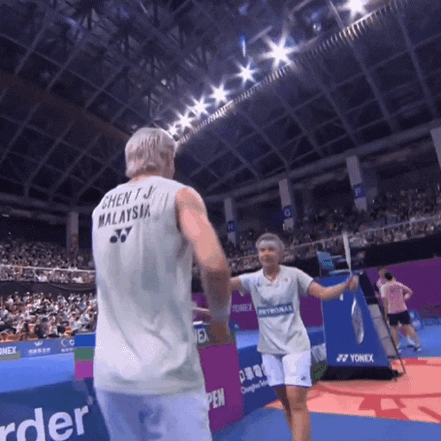 a man wearing a jersey that says ' chen j. malaysia ' on it