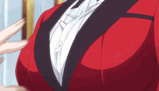 a close up of a woman 's chest in a red suit