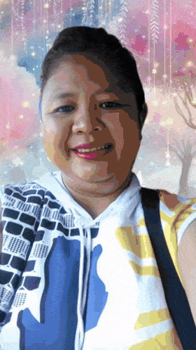 a woman wearing a blue and white striped shirt is smiling