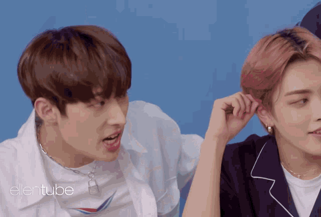a couple of boys are standing next to each other and the words ellentube are on the bottom
