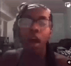 a woman wearing glasses and headphones is making a funny face .
