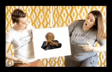 two women wearing shirts that say great vibes always and warrior not worries are holding a picture