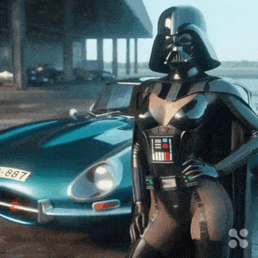 a woman in a darth vader costume is standing in front of a blue car with a license plate that says l-887
