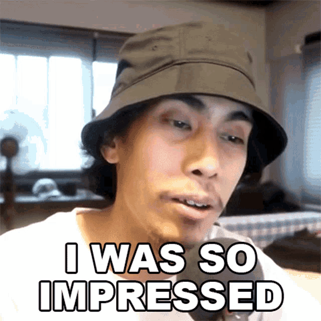 a man wearing a hat with the words i was so impressed on it