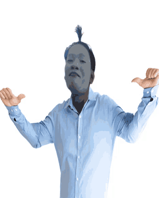 a man in a blue shirt is giving a thumbs down