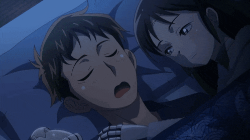 a man and a woman are laying in bed together