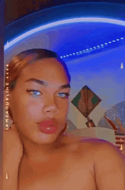 a woman taking a selfie with the name iamjaqueline 4444 on the bottom