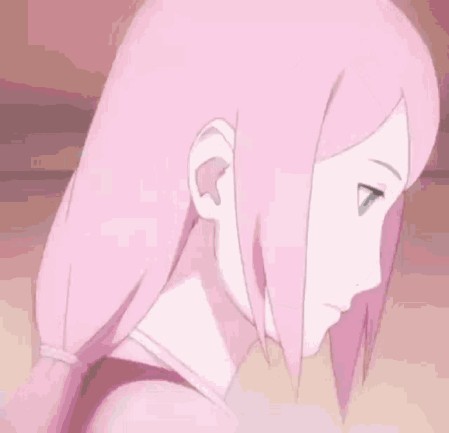 a close up of a pink haired anime girl with green eyes