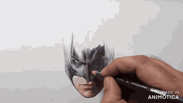 a person is drawing a batman face with a pencil made in animatica