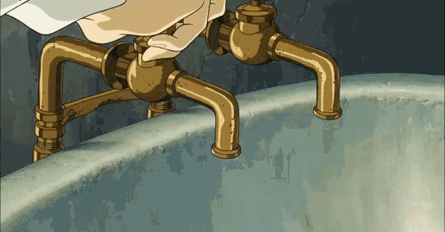a person is adjusting a faucet on a sink