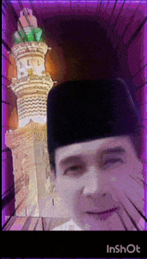 a man wearing a black hat is smiling in front of a clock tower with the number 1 on it