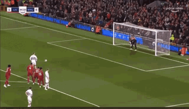 a soccer game is being played on a field sponsored by amazon