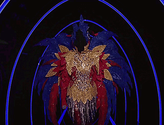 a woman in a colorful costume is walking through a purple tunnel