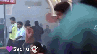 a group of people standing in a line with the name sachu on the bottom left