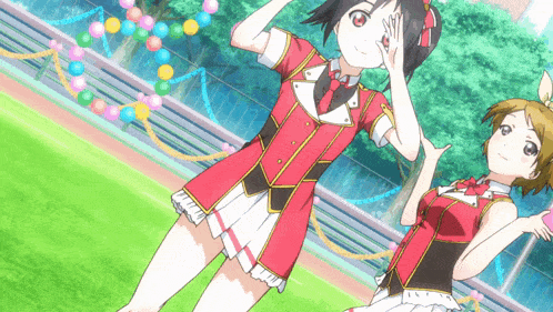 two anime girls are standing on a green field