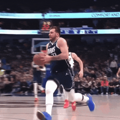 a basketball player for the dallas mavericks dribbles the basketball