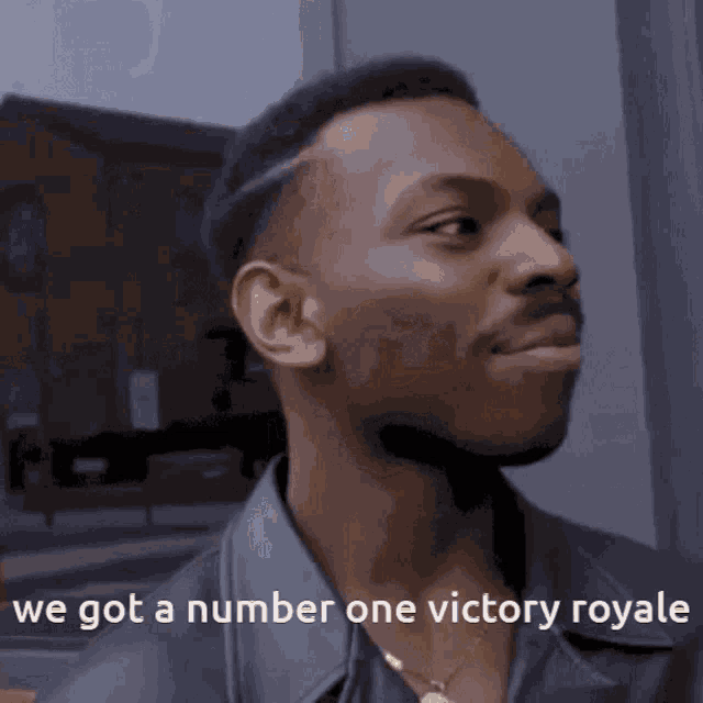 a man with the words we got a number one victory royale written on his face