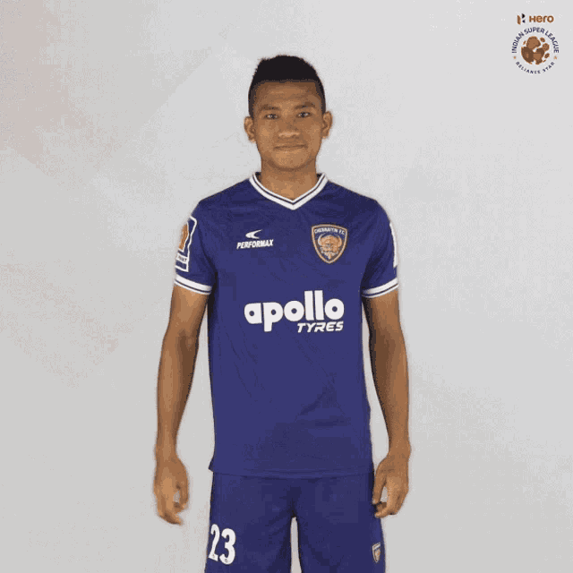 a soccer player wearing a blue jersey with apollo tyres on it