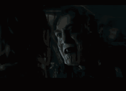 a close up of a person 's face with blood coming out of their mouth .