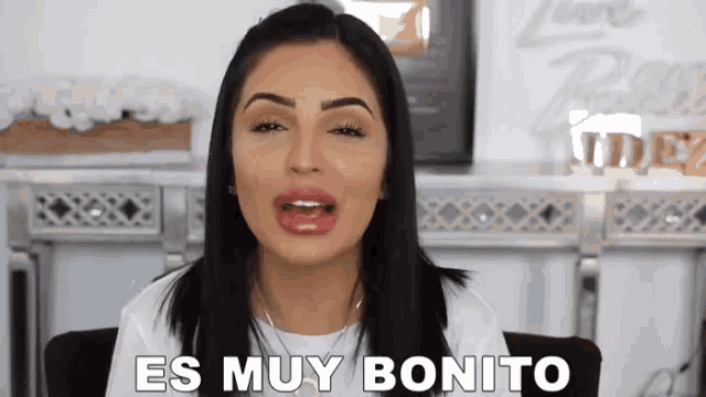 a woman says es muy bonito in a white shirt