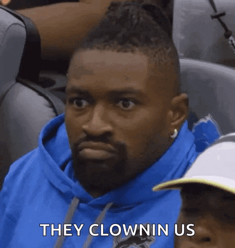 a man in a blue hoodie says they clown us