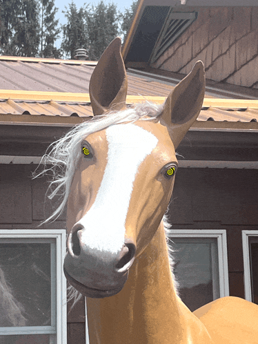 a statue of a horse with a white mane and green eyes