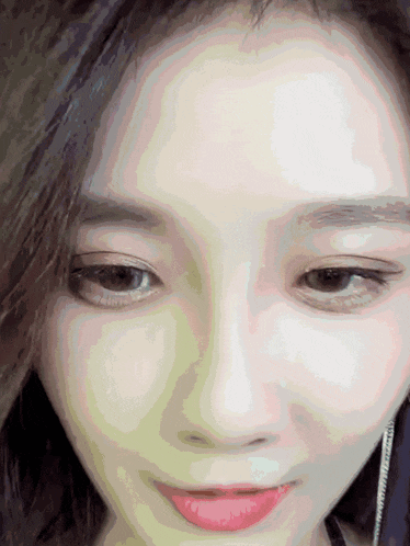 a close up of a woman 's face with her eyes closed