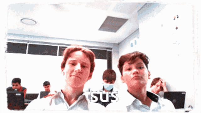two boys are standing next to each other and the word sus is on the bottom