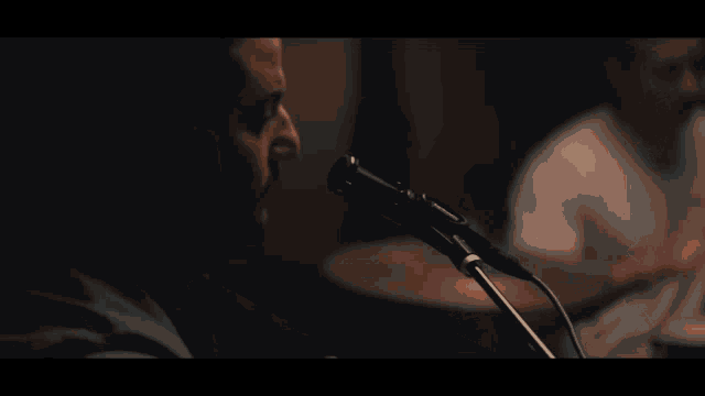 a blurry picture of a person playing drums
