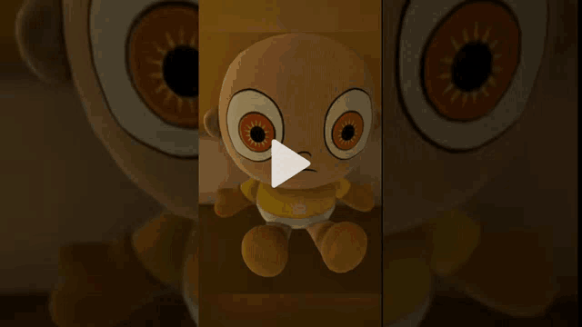 a stuffed animal with orange eyes and a yellow shirt has a play button in the corner