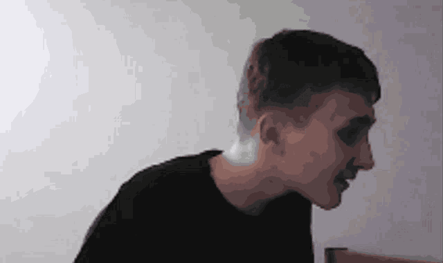 a pixelated image of a man 's face with a white background