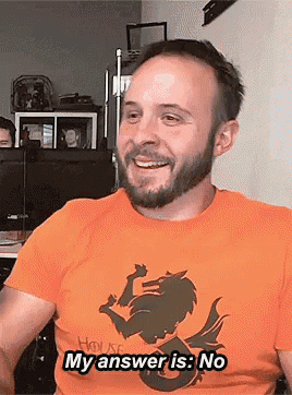 a man with a beard wearing an orange shirt with a dragon on it says my answer is no