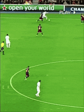cristiano ronaldo dribbles a soccer ball in front of a crowd