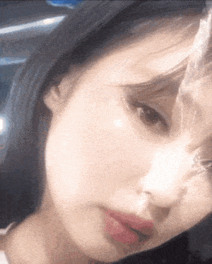 a close up of a woman 's face with red lips