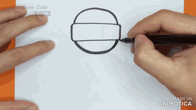a person is drawing a circle with a marker on a piece of paper that says draw cute things