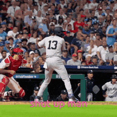 a baseball player with the number 13 on his jersey is about to swing his bat