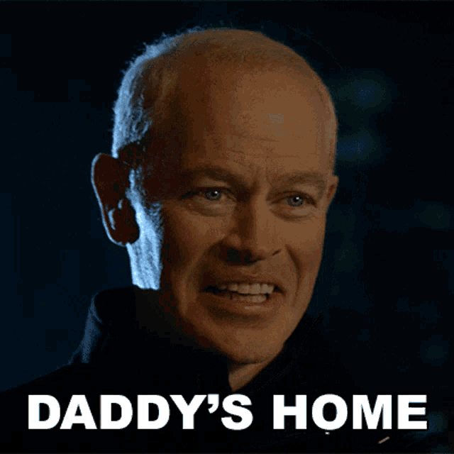 a close up of a man 's face with the words daddy 's home below him
