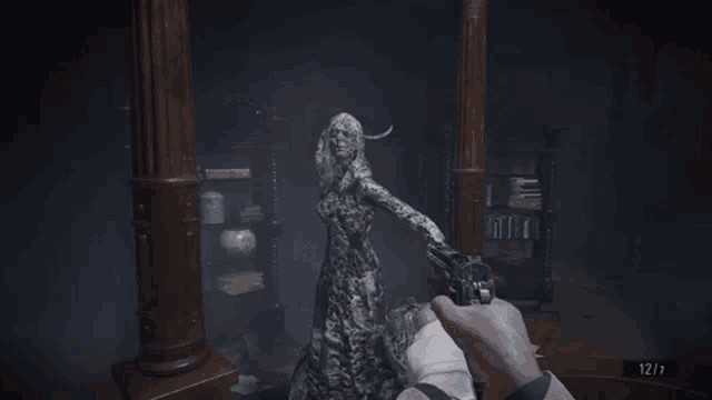 a man is holding a gun in front of a statue of a woman in a video game .