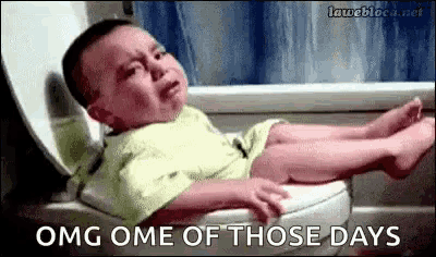 a baby is crying while sitting on a toilet with its legs crossed .