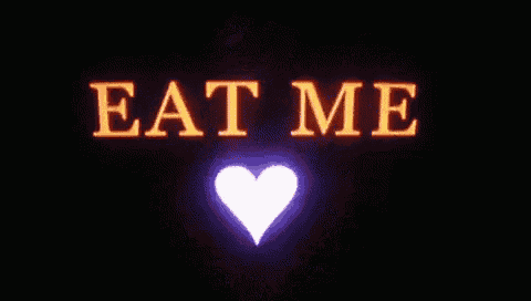 a sign that says eat me with a heart in the corner