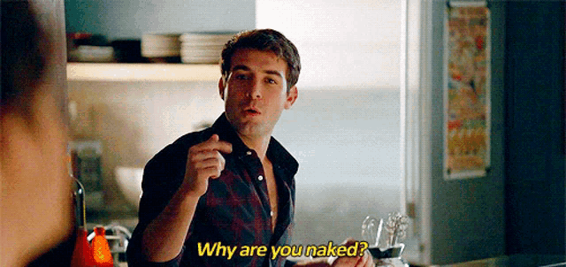a man in a plaid shirt is pointing at another man and asking why are you naked