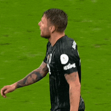a soccer player wearing a number 17 jersey is running on the field