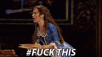 a woman in a blue dress is holding a piece of paper in her hand and saying `` fuck this '' .