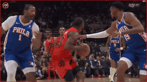 a philadelphia basketball player is being fouled by a philadelphia player
